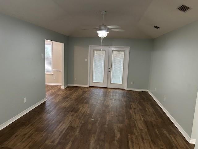 6611 Morgan Jackson Ct, Mobile, AL 36582 - empty room featuring ceiling fan, dark wood-type flooring, baseboards, and french doors