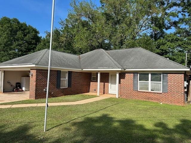 6611 Morgan Jackson Ct, Mobile, AL 36582 - single story home featuring a front yard, an attached carport, concrete driveway, brick siding, and roof with shingles