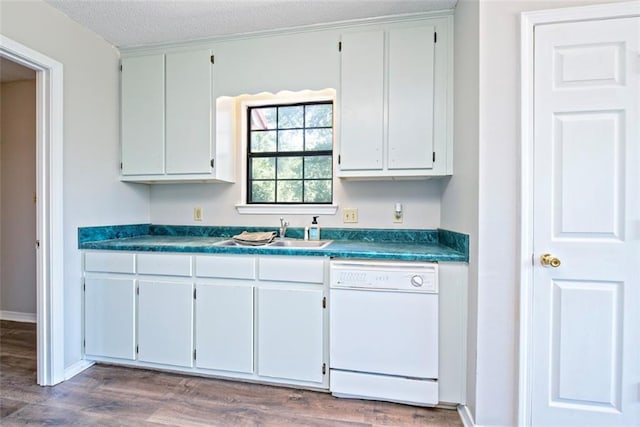 17180 Jim Platt Rd, Citronelle, AL 36522 - kitchen featuring dishwasher, a sink, dark countertops, wood finished floors, and a textured ceiling