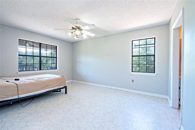 17180 Jim Platt Rd, Citronelle, AL 36522 - bedroom featuring a textured ceiling, baseboards, and ceiling fan