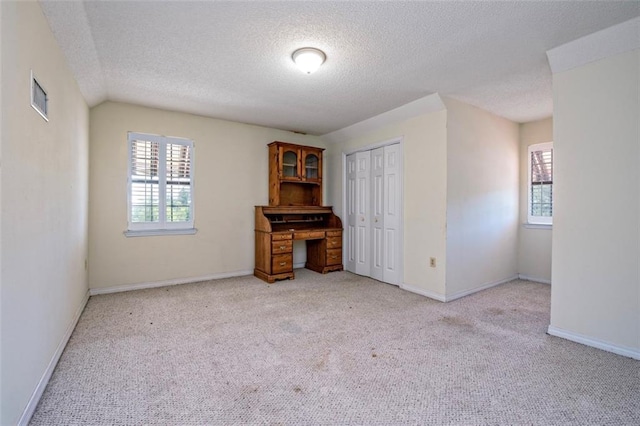17180 Jim Platt Rd, Citronelle, AL 36522 - unfurnished living room with light colored carpet, a textured ceiling, and baseboards