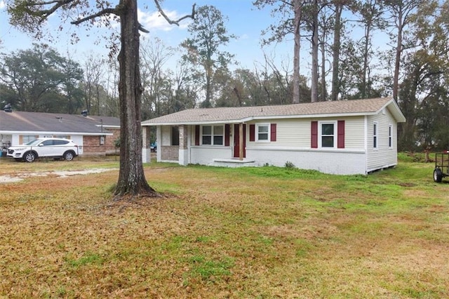 view of front of property with a porch and a front yard