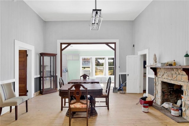 52780 State Highway 59, Stockton, AL 36579 - dining space featuring light wood-style floors and a stone fireplace