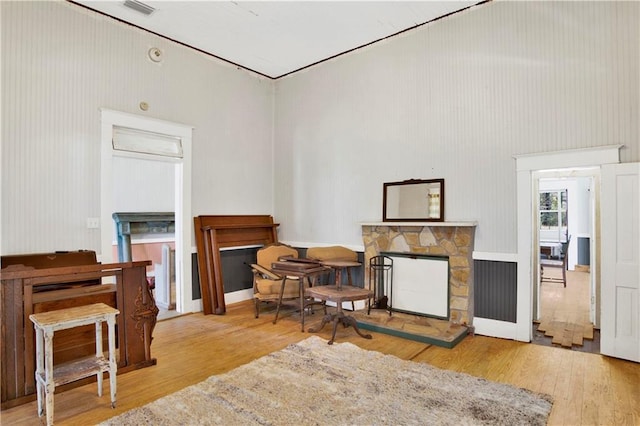 52780 State Highway 59, Stockton, AL 36579 - living area with a stone fireplace, a towering ceiling, and wood finished floors