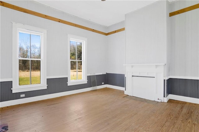 52780 State Highway 59, Stockton, AL 36579 - unfurnished living room with a fireplace with flush hearth and wood finished floors