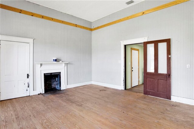 52780 State Highway 59, Stockton, AL 36579 - unfurnished living room with visible vents, wood finished floors, and a fireplace