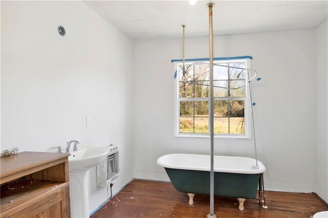 52780 State Highway 59, Stockton, AL 36579 - bathroom with a sink, a freestanding bath, wood finished floors, and heating unit
