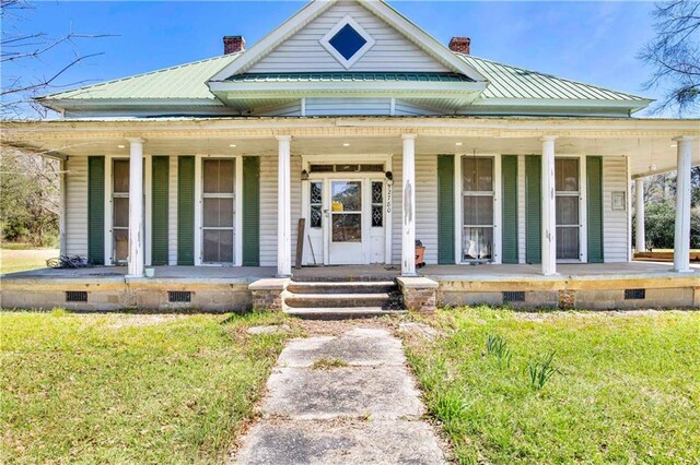 52780 State Highway 59, Stockton, AL 36579 - farmhouse-style home featuring a porch, crawl space, and a chimney