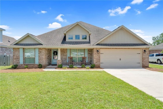 25504 Sunrise Ct, Loxley, AL 36551 - view of front facade with brick siding, a garage, driveway, a porch, and a shingled roof