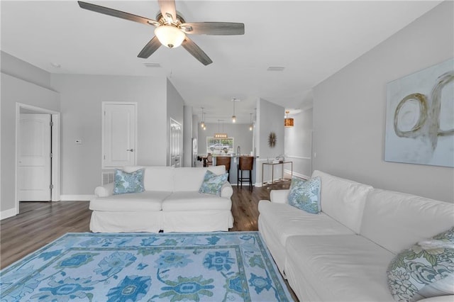 25504 Sunrise Ct, Loxley, AL 36551 - living area featuring wood finished floors, a ceiling fan, and baseboards