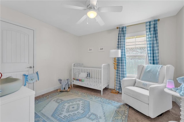 25504 Sunrise Ct, Loxley, AL 36551 - bedroom with a crib, baseboards, and a ceiling fan