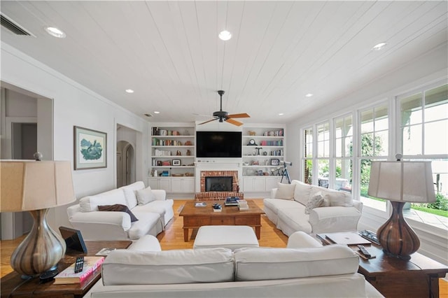 3009 Riverside Dr, Mobile, AL 36605 - living room with ceiling fan, a fireplace, light wood finished floors, recessed lighting, and built in features