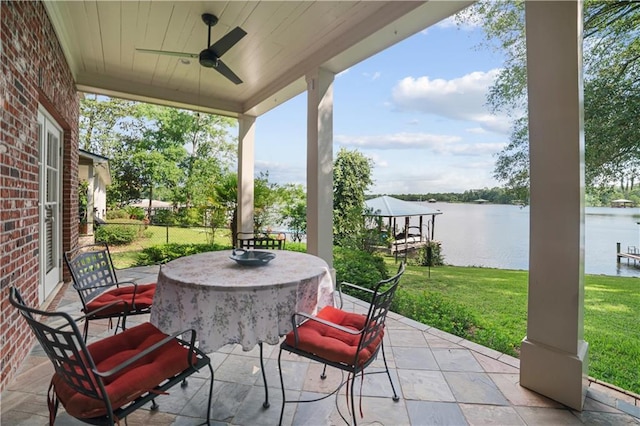3009 Riverside Dr, Mobile, AL 36605 - view of patio / terrace with a water view, ceiling fan, and outdoor dining area