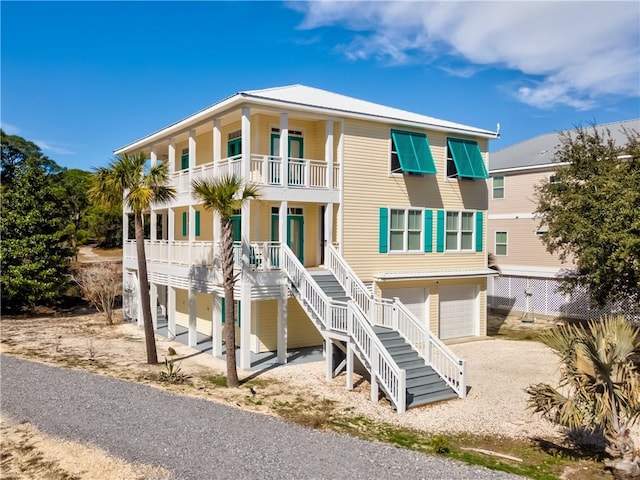 view of front facade with a balcony and a garage