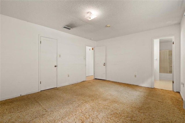 3163 Morgan Rd, Mobile, AL 36605 - carpeted spare room with a textured ceiling