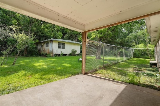 3163 Morgan Rd, Mobile, AL 36605 - view of yard featuring a patio, an outbuilding, and view of scattered trees