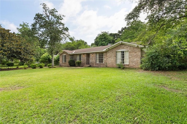 3163 Morgan Rd, Mobile, AL 36605 - ranch-style house featuring a front yard and brick siding