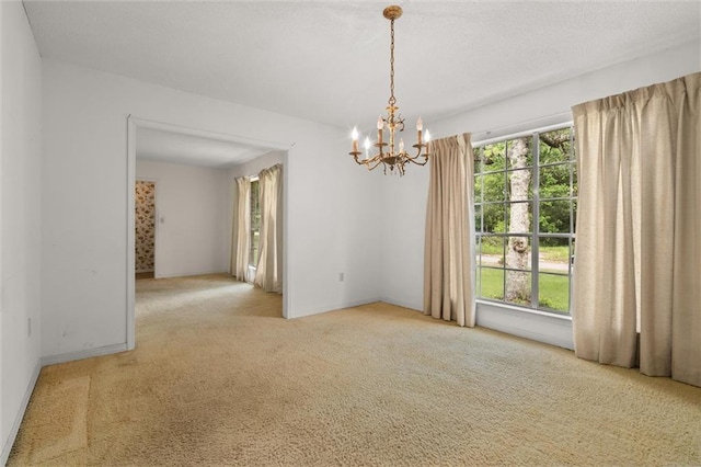 3163 Morgan Rd, Mobile, AL 36605 - carpeted empty room with a chandelier