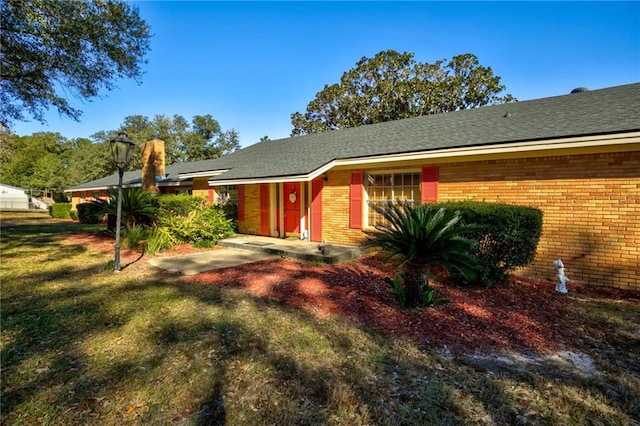 exterior space with a front lawn