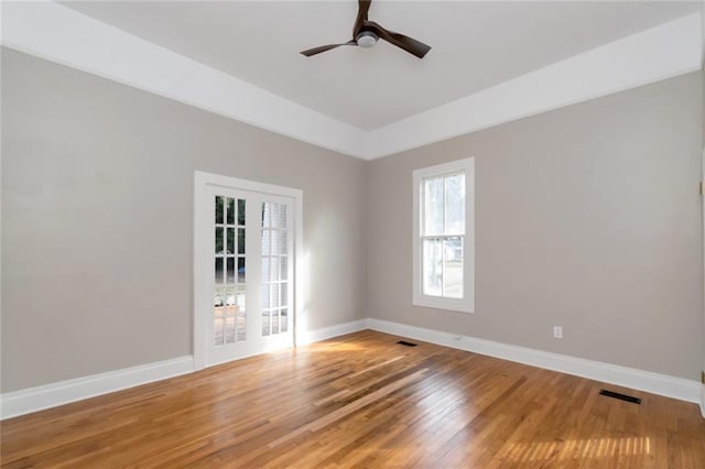 empty room with wood-type flooring and ceiling fan