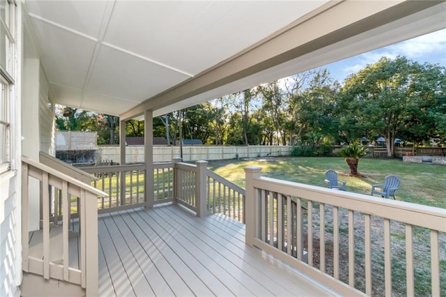 wooden terrace with a yard