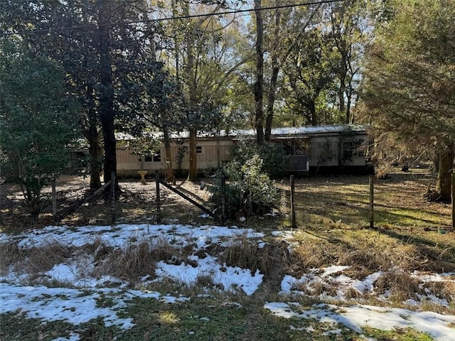 view of yard layered in snow