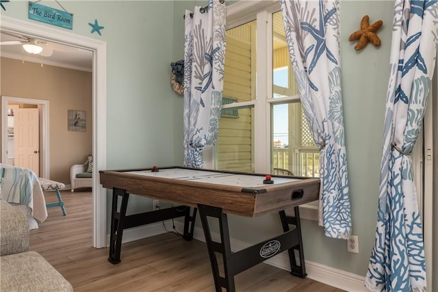 106 Serigny Ct, Dauphin Island, AL 36528 - rec room featuring crown molding, wood finished floors, baseboards, and ceiling fan