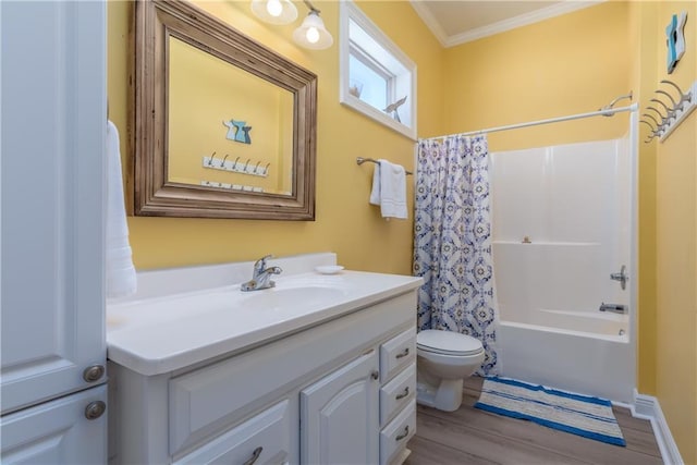 106 Serigny Ct, Dauphin Island, AL 36528 - full bathroom with ornamental molding, vanity, toilet, wood finished floors, and shower / tub combo
