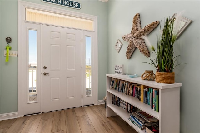 106 Serigny Ct, Dauphin Island, AL 36528 - entrance foyer with wood finished floors and baseboards
