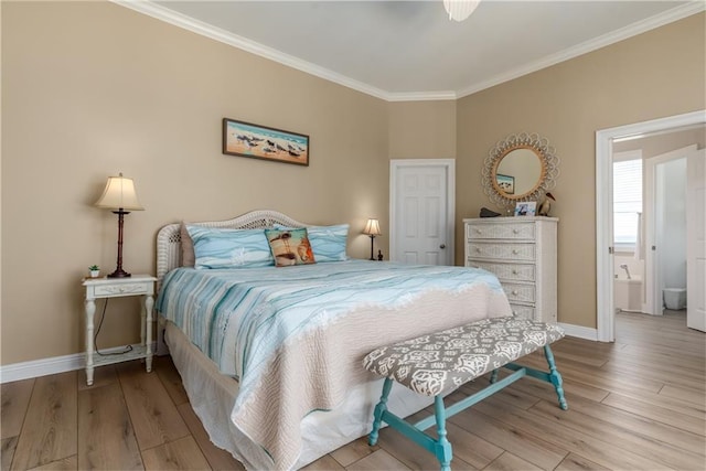 106 Serigny Ct, Dauphin Island, AL 36528 - bedroom featuring crown molding, wood finished floors, and baseboards