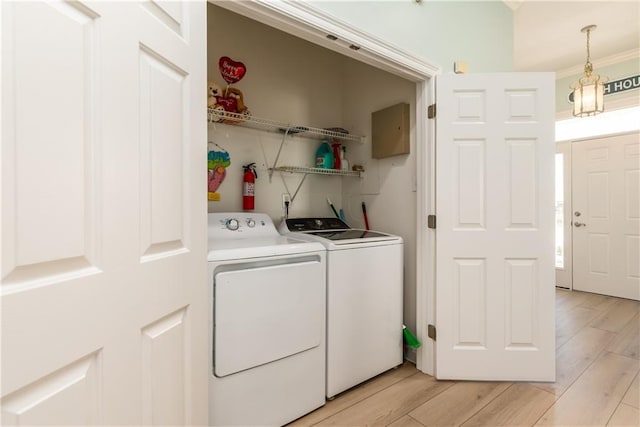 106 Serigny Ct, Dauphin Island, AL 36528 - laundry area featuring independent washer and dryer and light wood-style floors