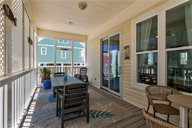 106 Serigny Ct, Dauphin Island, AL 36528 - wooden terrace with outdoor dining space