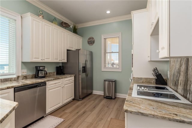 106 Serigny Ct, Dauphin Island, AL 36528 - kitchen with stainless steel appliances, white cabinetry, ornamental molding, light wood finished floors, and baseboards