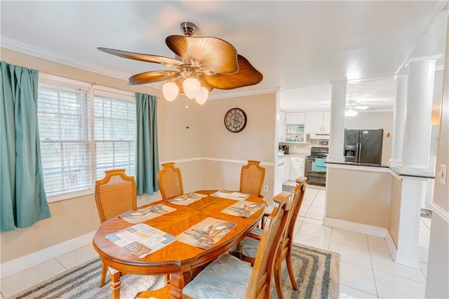 dining space featuring ceiling fan, baseboards, ornamental molding, light tile patterned floors, and ornate columns