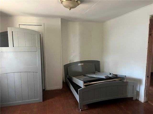 bedroom featuring dark hardwood / wood-style flooring