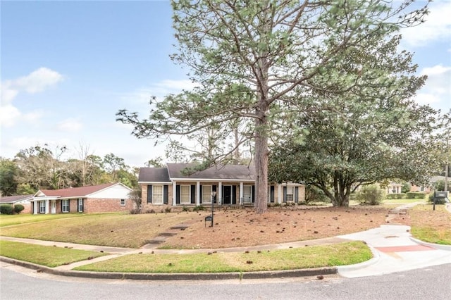 ranch-style house with a front lawn