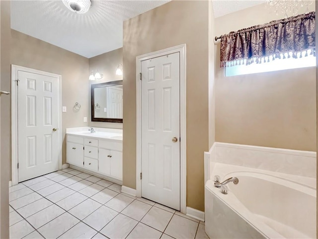 bathroom featuring tile patterned flooring, vanity, and a tub to relax in