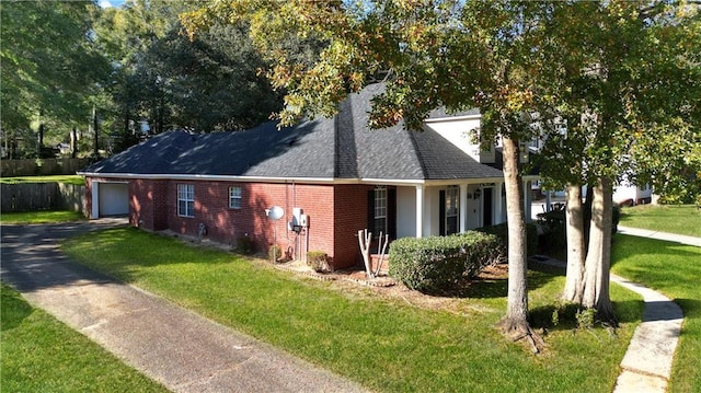 view of front facade featuring a front yard and a garage