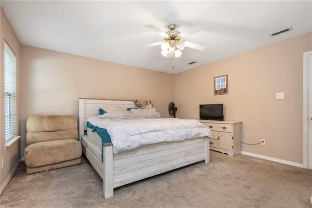 bedroom with light colored carpet and ceiling fan