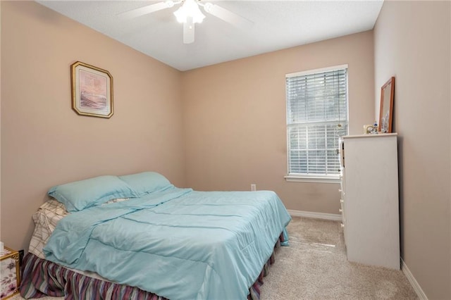 bedroom featuring ceiling fan and light colored carpet