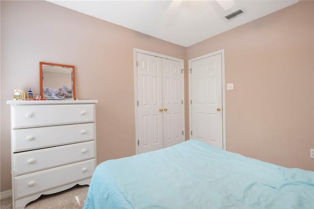 carpeted bedroom with ceiling fan