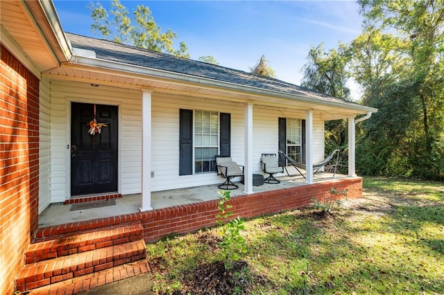 entrance to property featuring covered porch