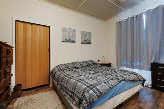 bedroom featuring wood finished floors