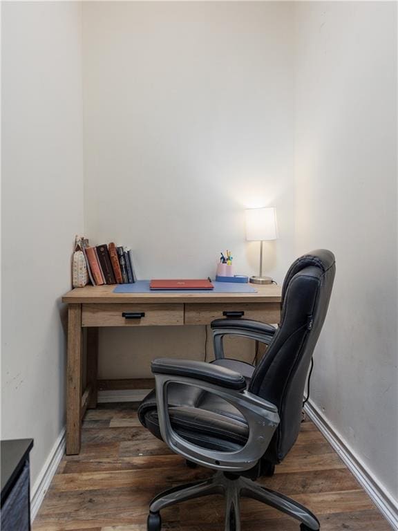 office area with baseboards and wood finished floors