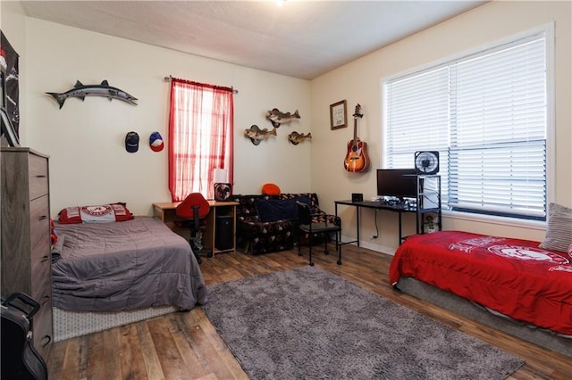 bedroom with wood finished floors