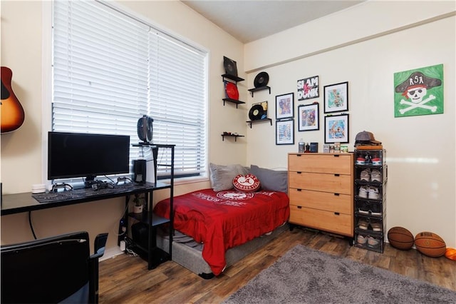 bedroom with wood finished floors