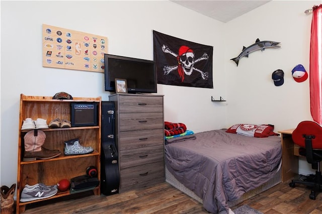 bedroom featuring wood finished floors