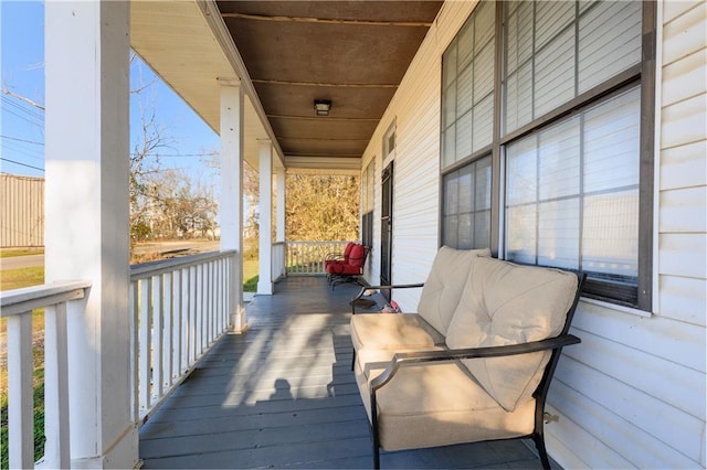 wooden terrace featuring a porch