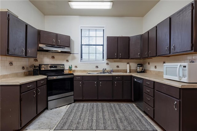 kitchen with white microwave, backsplash, under cabinet range hood, dishwasher, and stainless steel range with electric cooktop