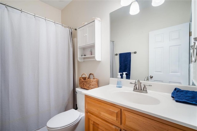 bathroom with toilet and vanity